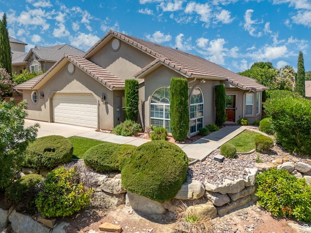 3524 S Price Hills Dr, St George, UT 84790 - ranch-style house featuring a garage, stucco siding, concrete driveway, and a tiled roof