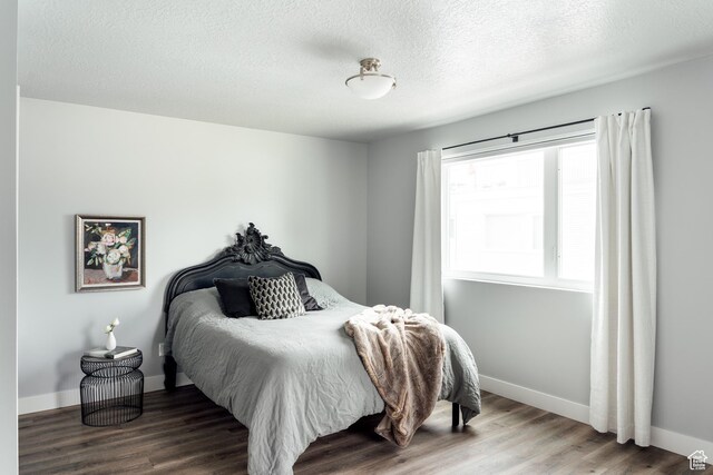 736 S 300 E Unit 1A, Salt Lake City, UT 84111 - bedroom with wood finished floors and a textured ceiling