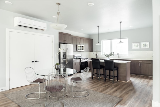 736 S 300 E Unit 1A, Salt Lake City, UT 84111 - dining area featuring a wall mounted AC, wood finished floors, and recessed lighting
