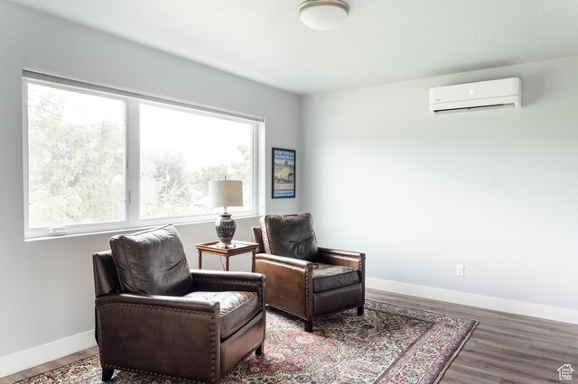 736 S 300 E Unit 1A, Salt Lake City, UT 84111 - living area with an AC wall unit and wood finished floors