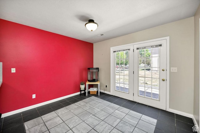 162 W 1275 S Unit 162, Logan, UT 84321 - spare room featuring an accent wall and tile patterned flooring