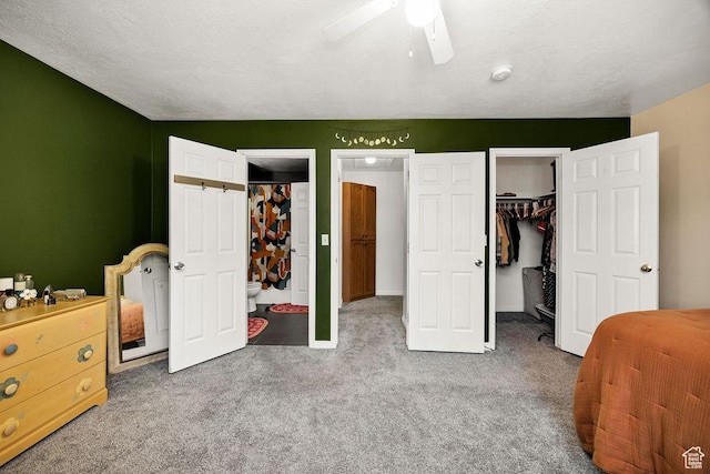 162 W 1275 S Unit 162, Logan, UT 84321 - bedroom featuring a spacious closet, carpet floors, a closet, and a ceiling fan