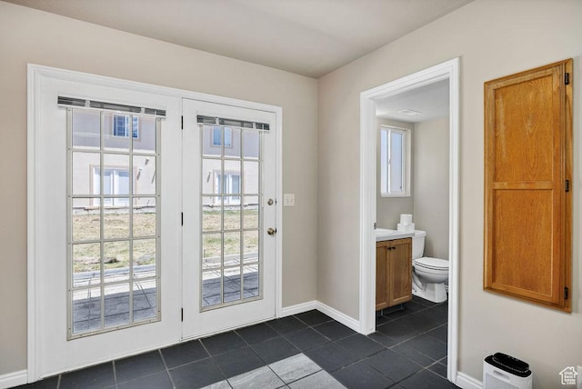 162 W 1275 S Unit 162, Logan, UT 84321 - doorway to outside with dark tile patterned floors and healthy amount of natural light