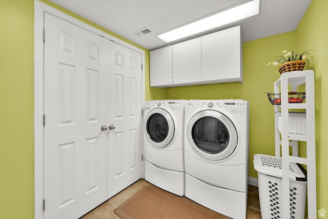 1269 Alice Ln, Farmington, UT 84025 - washroom featuring cabinet space, washing machine and clothes dryer, and light tile patterned flooring