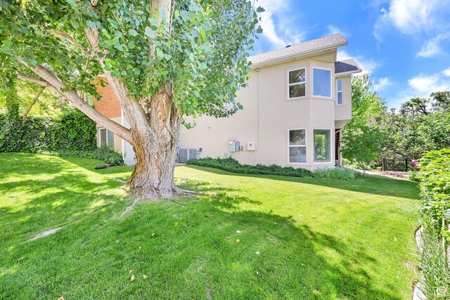 1269 Alice Ln, Farmington, UT 84025 - back of house with stucco siding and a yard