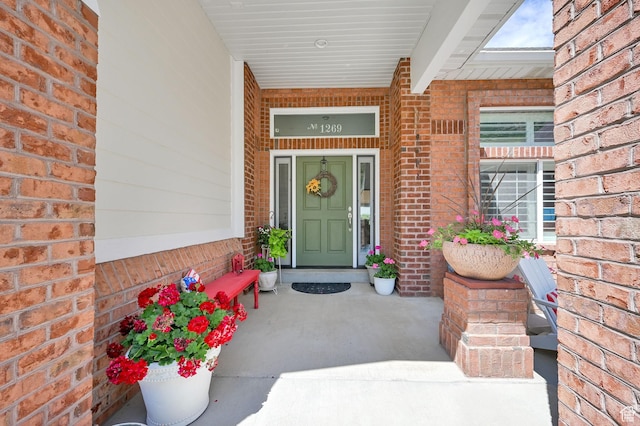 1269 Alice Ln, Farmington, UT 84025 - view of exterior entry with brick siding and a porch