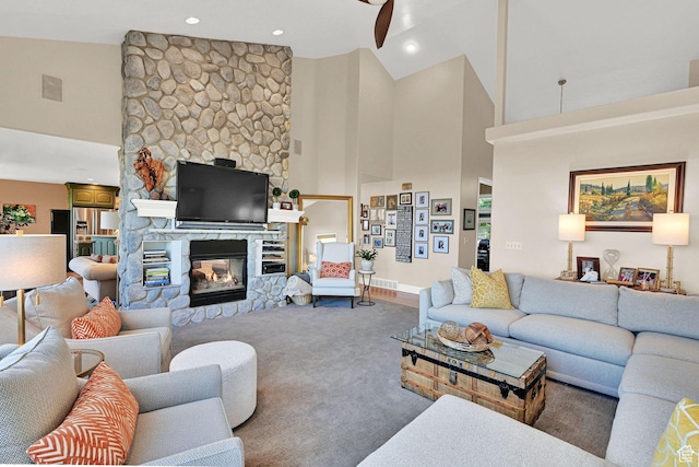 1269 Alice Ln, Farmington, UT 84025 - living room featuring high vaulted ceiling, a stone fireplace, carpet, and recessed lighting