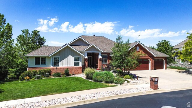 1269 Alice Ln, Farmington, UT 84025 - craftsman-style home with brick siding, board and batten siding, concrete driveway, an attached garage, and a front lawn