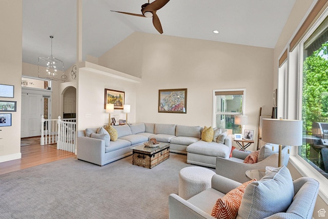 1269 Alice Ln, Farmington, UT 84025 - living area with high vaulted ceiling, plenty of natural light, arched walkways, ceiling fan, and wood finished floors