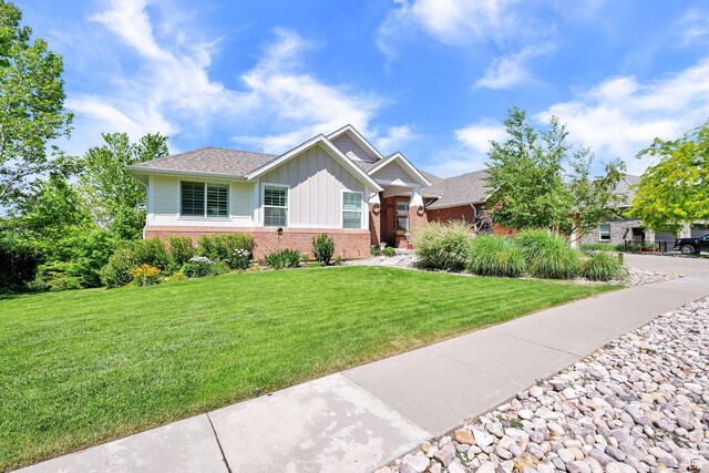 1269 Alice Ln, Farmington, UT 84025 - view of front of property featuring brick siding, board and batten siding, and a front lawn