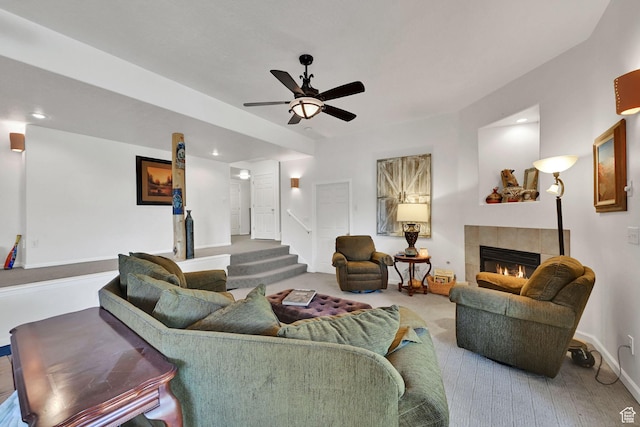 1269 Alice Ln, Farmington, UT 84025 - living room featuring a tile fireplace, ceiling fan, recessed lighting, and stairs