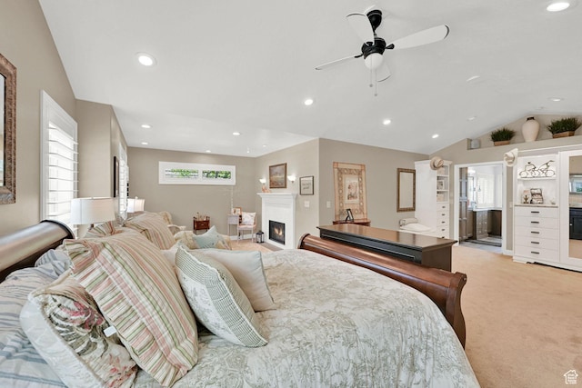 1269 Alice Ln, Farmington, UT 84025 - bedroom with light colored carpet, multiple windows, a lit fireplace, lofted ceiling, and recessed lighting