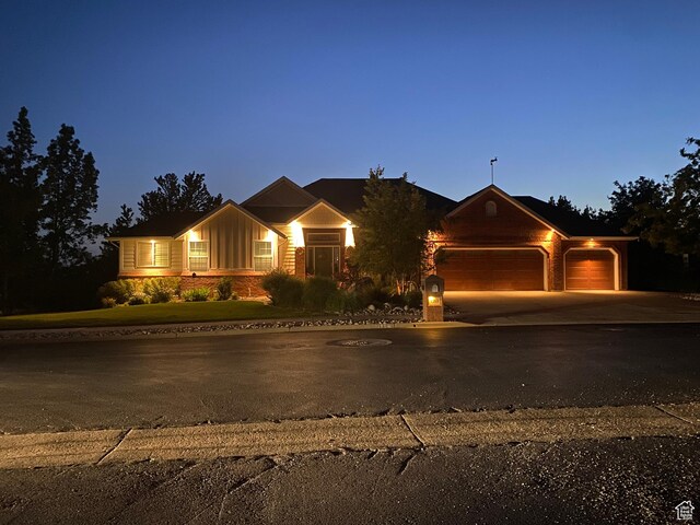 1269 Alice Ln, Farmington, UT 84025 - view of front of property with a garage, board and batten siding, and driveway