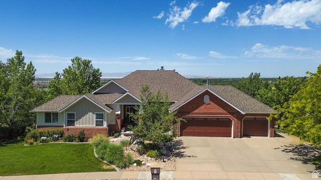 1269 Alice Ln, Farmington, UT 84025 - view of front facade with brick siding, an attached garage, board and batten siding, concrete driveway, and a front yard
