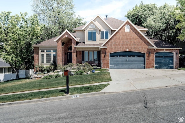 3551 S Huntington Dr, Bountiful, UT 84010 - traditional home featuring brick siding, a garage, concrete driveway, and a shingled roof