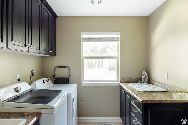 3551 S Huntington Dr, Bountiful, UT 84010 - laundry area featuring washer and dryer, cabinet space, and healthy amount of natural light