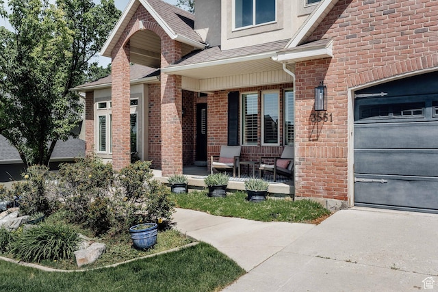 3551 S Huntington Dr, Bountiful, UT 84010 - doorway to property featuring a porch, roof with shingles, and brick siding