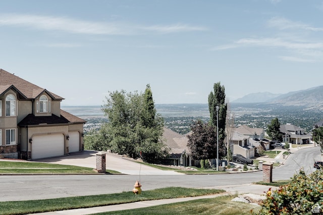 3551 S Huntington Dr, Bountiful, UT 84010 - view of asphalt street featuring street lighting, sidewalks, curbs, and a mountain view