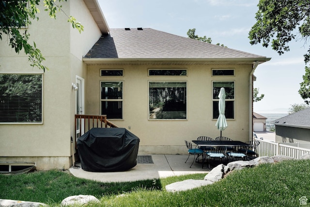 3551 S Huntington Dr, Bountiful, UT 84010 - back of house featuring roof with shingles, a patio, and stucco siding