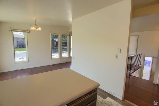 2266 W Arches Dr, Taylorsville, UT 84129 - dining space with dark wood-style flooring and a chandelier