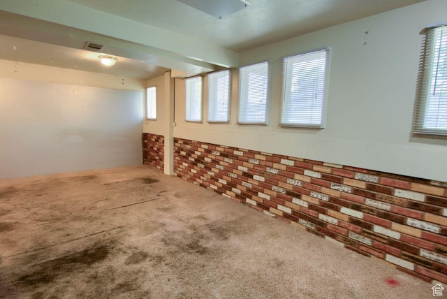 2266 W Arches Dr, Taylorsville, UT 84129 - basement with carpet flooring and brick wall