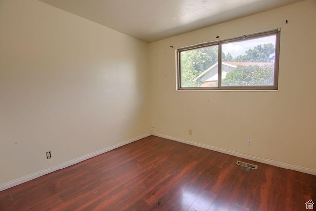 2266 W Arches Dr, Taylorsville, UT 84129 - empty room with dark wood-style floors and baseboards
