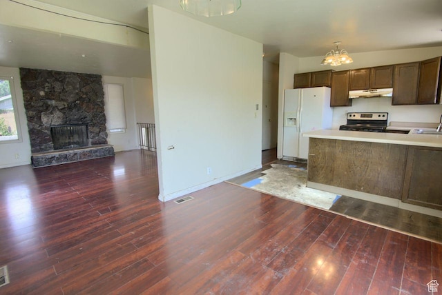 2266 W Arches Dr, Taylorsville, UT 84129 - kitchen with electric stove, white fridge with ice dispenser, open floor plan, and hardwood / wood-style floors