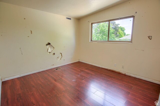 2266 W Arches Dr, Taylorsville, UT 84129 - empty room featuring wood finished floors and baseboards