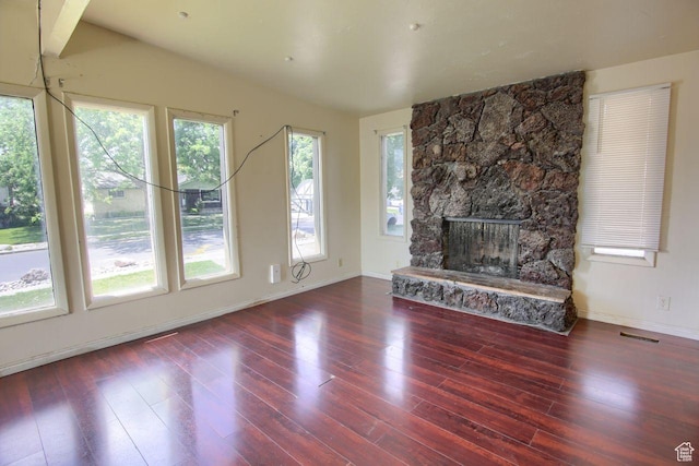 2266 W Arches Dr, Taylorsville, UT 84129 - unfurnished living room featuring wood finished floors and a fireplace