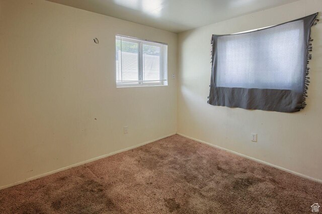 2266 W Arches Dr, Taylorsville, UT 84129 - carpeted empty room featuring baseboards