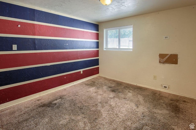 2266 W Arches Dr, Taylorsville, UT 84129 - carpeted empty room featuring a textured wall and a textured ceiling