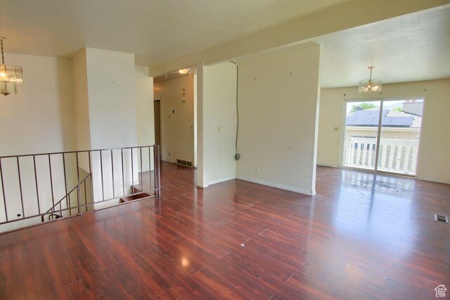2266 W Arches Dr, Taylorsville, UT 84129 - spare room with a chandelier and wood finished floors