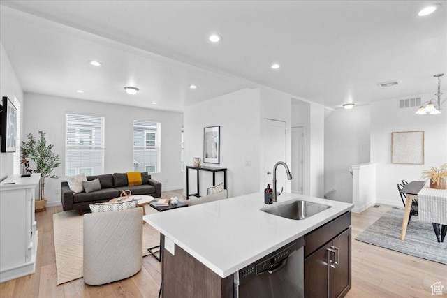 5504 W Burntside Ave, South Jordan, UT 84009 - kitchen with dishwasher, light wood-type flooring, light countertops, dark brown cabinets, and recessed lighting