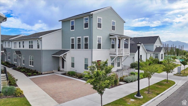 5504 W Burntside Ave, South Jordan, UT 84009 - view of property with stucco siding and a mountain view
