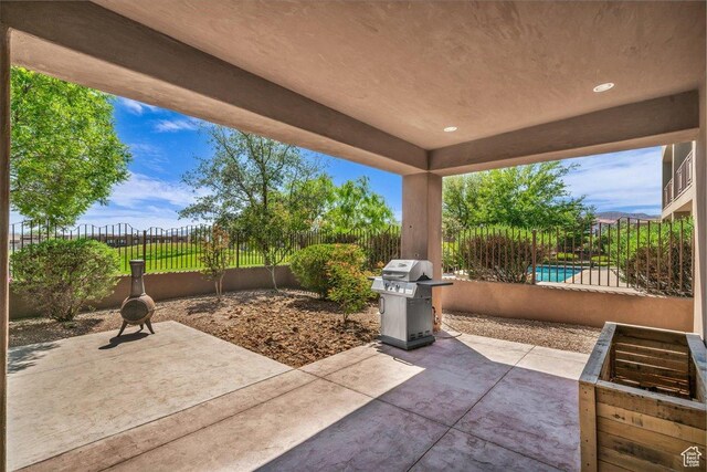 1683 W Red Cloud Dr, St George, UT 84770 - fenced backyard with a patio and a grill