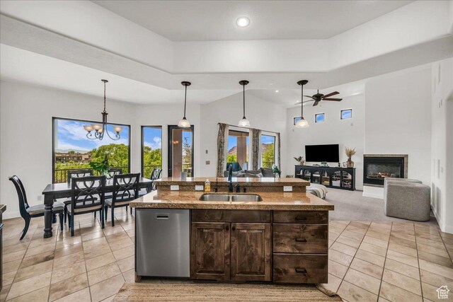1683 W Red Cloud Dr, St George, UT 84770 - kitchen featuring dishwasher, light tile patterned floors, a ceiling fan, dark brown cabinetry, and pendant lighting