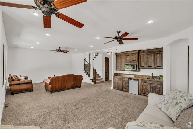 1683 W Red Cloud Dr, St George, UT 84770 - living room featuring stairs, recessed lighting, light carpet, and ceiling fan