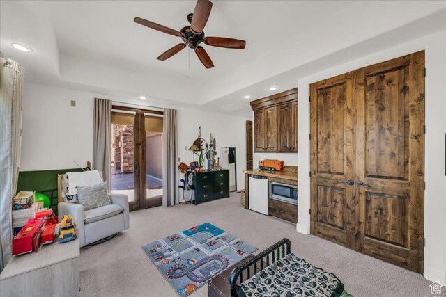 1683 W Red Cloud Dr, St George, UT 84770 - living area featuring light colored carpet, ceiling fan, recessed lighting, and a tray ceiling