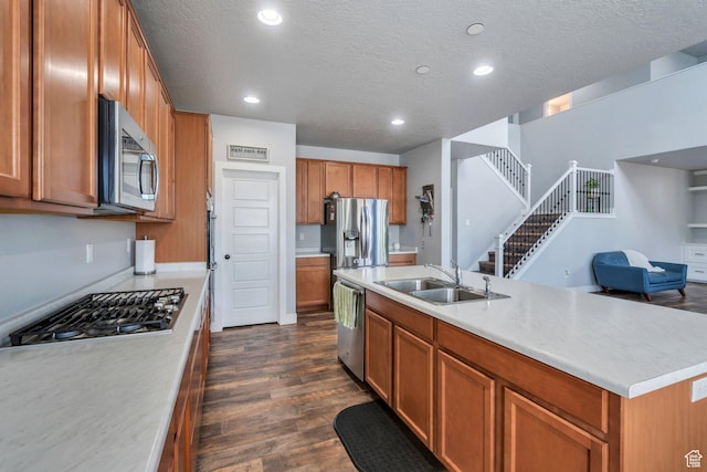 123 E 460 N, Vineyard, UT 84059 - kitchen featuring stainless steel appliances, dark wood-style floors, open floor plan, brown cabinetry, and light countertops