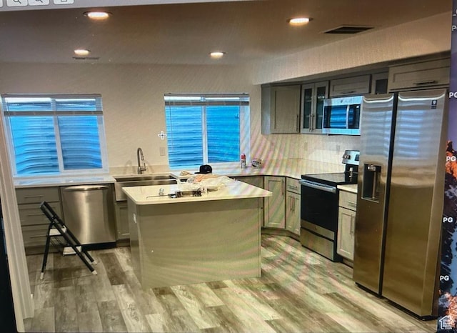 123 E 460 N, Vineyard, UT 84059 - kitchen with appliances with stainless steel finishes, light countertops, light wood finished floors, glass insert cabinets, and recessed lighting