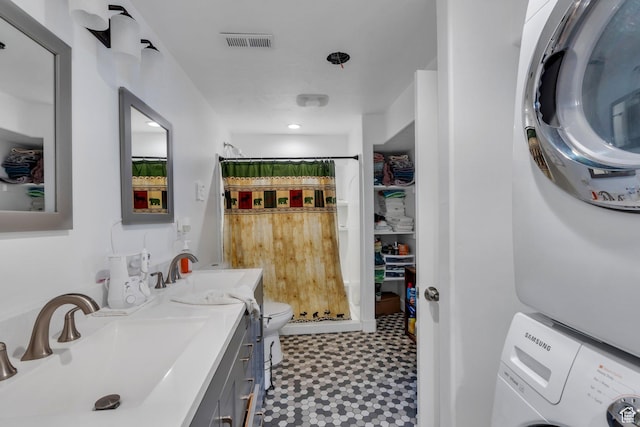 123 E 460 N, Vineyard, UT 84059 - bathroom featuring stacked washing machine and dryer, tile patterned floors, a shower with shower curtain, and vanity