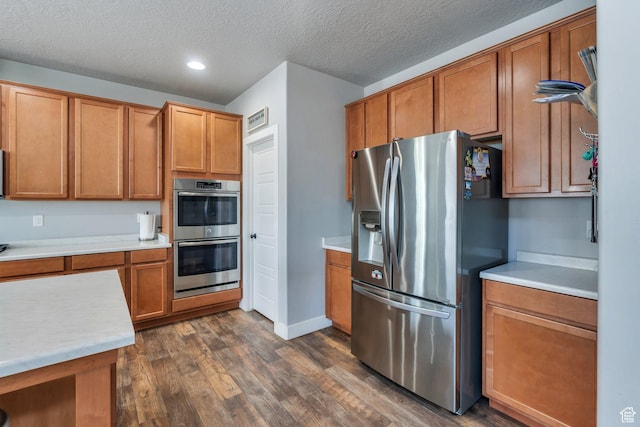 123 E 460 N, Vineyard, UT 84059 - kitchen with stainless steel appliances, dark wood finished floors, brown cabinetry, light countertops, and recessed lighting
