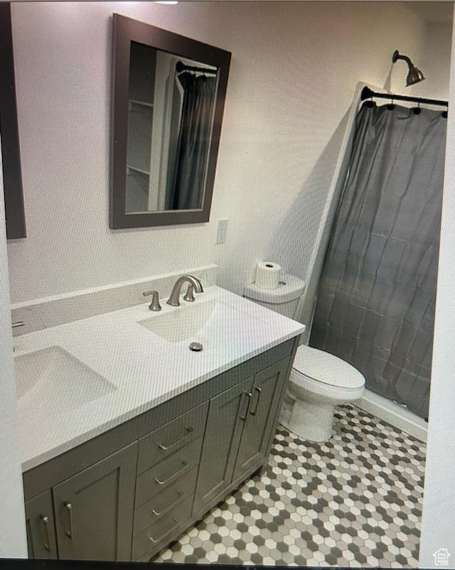 123 E 460 N, Vineyard, UT 84059 - bathroom with double vanity, a shower with curtain, and tile patterned flooring