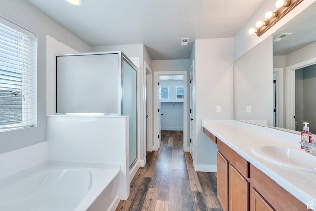 123 E 460 N, Vineyard, UT 84059 - bathroom featuring a shower stall, vanity, a bath, and wood finished floors