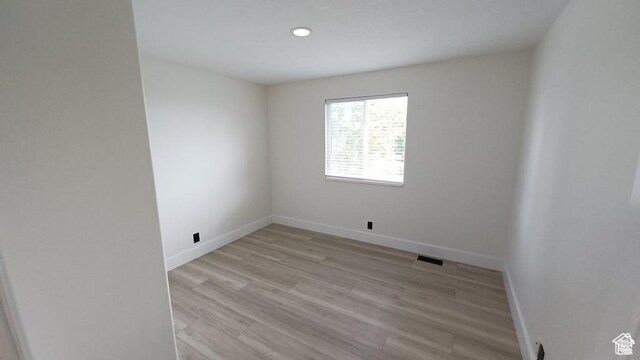 6116 W Graceland Way, West Jordan, UT 84081 - spare room with light wood-style floors and recessed lighting