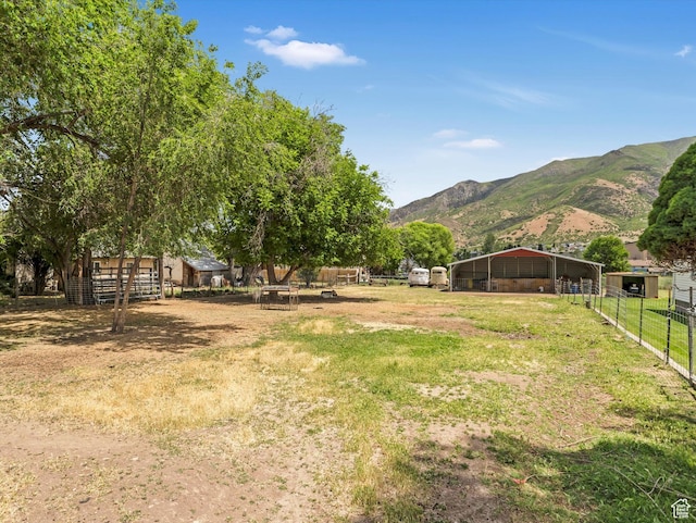 160 N 300 E, Santaquin, UT 84655 - view of yard with a detached carport, a mountain view, an outbuilding, and an exterior structure