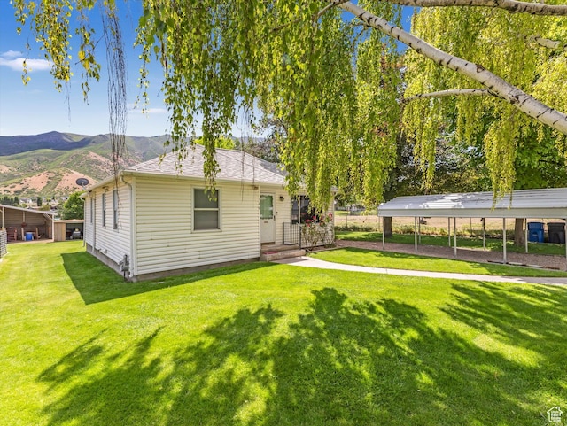 160 N 300 E, Santaquin, UT 84655 - view of front of home featuring a mountain view, a front lawn, and a carport