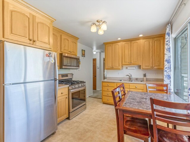 160 N 300 E, Santaquin, UT 84655 - kitchen with stainless steel appliances, light brown cabinetry, light countertops, recessed lighting, and light flooring