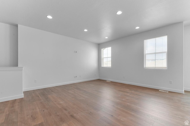 1881 E Moho Mtn, Eagle Mountain, UT 84005 - spare room featuring light wood-type flooring and recessed lighting