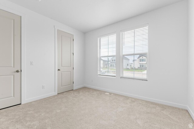 1881 E Moho Mtn, Eagle Mountain, UT 84005 - unfurnished bedroom featuring light carpet and baseboards